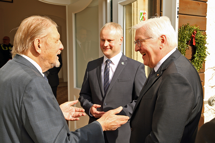 Paul Gauselmann and President Frank-Walter Steinmeier conversing in the presence of Espelkamp Mayor Dr. Henning Vieker